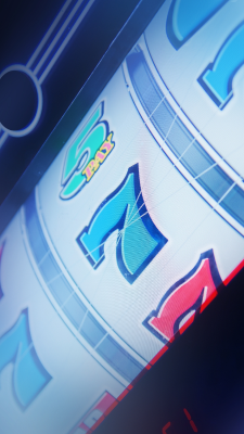 A slot machine closeup showing the numbers "777"